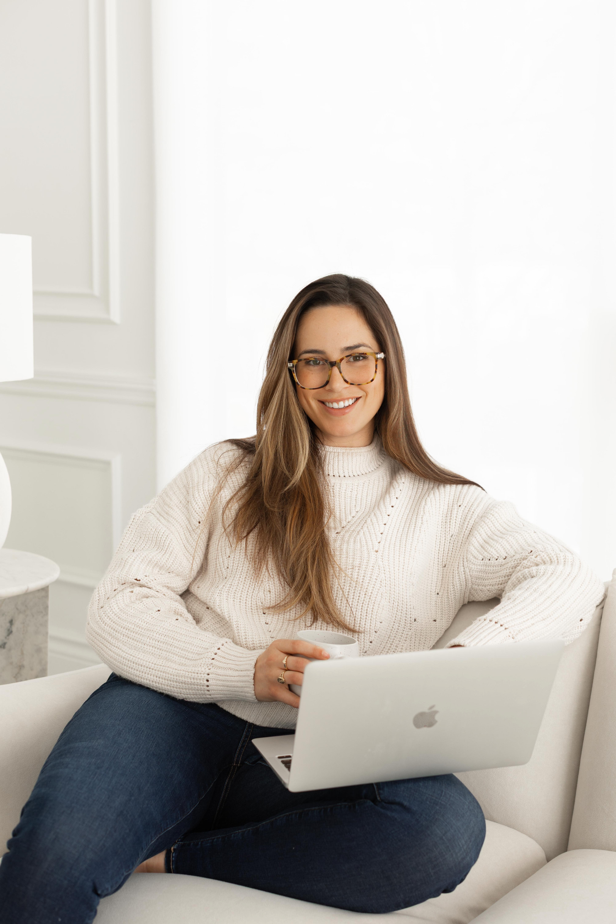 Audrey Locane smiling on a couch, offering virtual support across Ontario